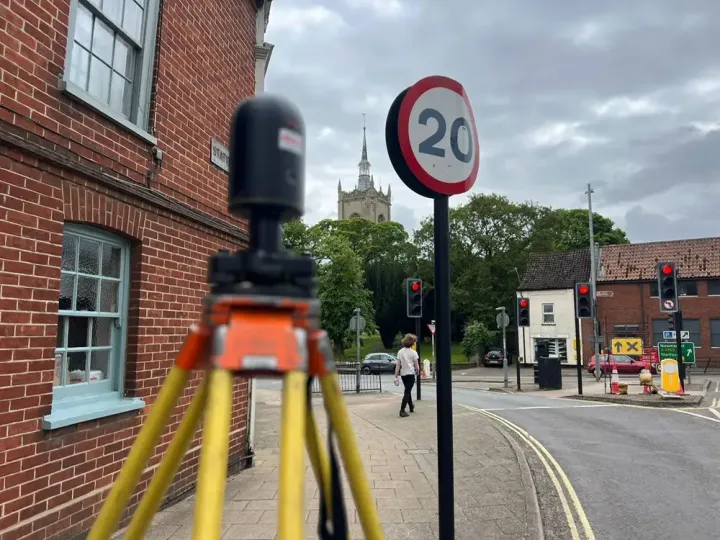 Leica BLK360 laser scanner on a tripod during a measured building survey in a market town