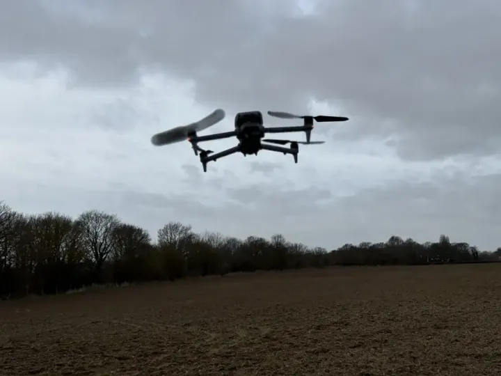 DJI Matrice survey drone in flight over open farmland